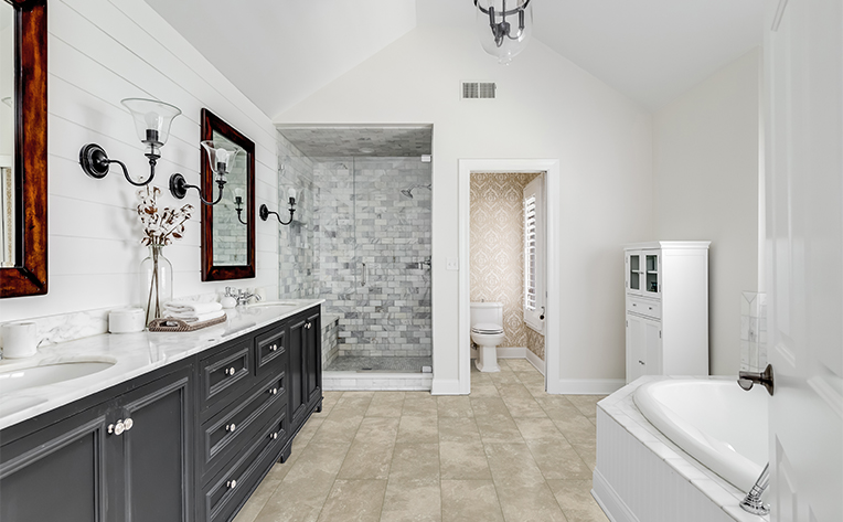 bathroom with tile flooring and some warm tones